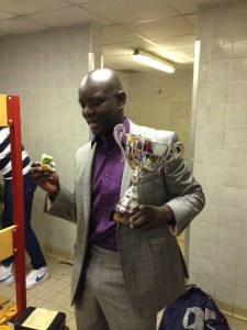 A dapper Moz Clarke with trophy and man of the match cow