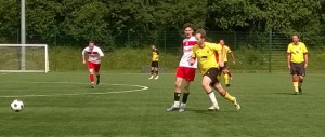 Richard Murphy beats a Stevenage player, watched by old-timer Paul Watt.